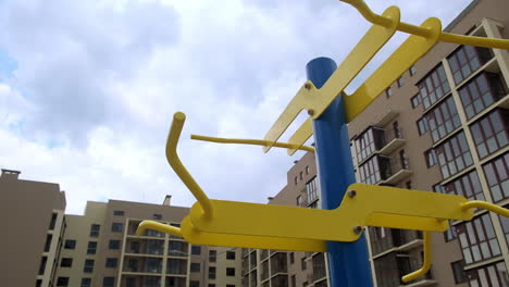 outdoor exercise equipment in front of apartments