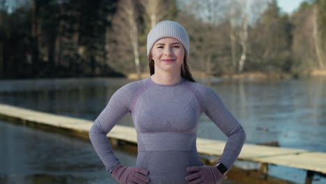 Portrait-of-caucasian-woman-before-swimming-in-frozen-lake.