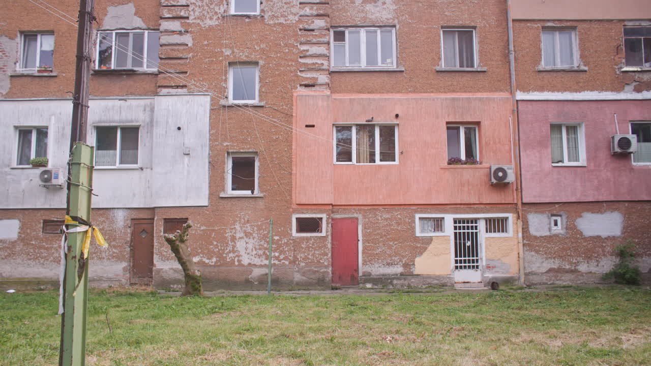 A neighborhood with communist architecture apartment buildings and the surrounding neighborhood environment, garden and trees from the communist era on the Balkans in Sofia, Bulgaria, Eastern Europe