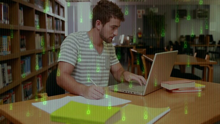 Studying in library, man using laptop with binary code animation over scene