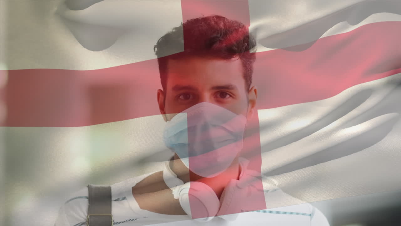animación de la bandera de inglaterra ondeando sobre un hombre que usa una máscara facial durante la pandemia de covid-19