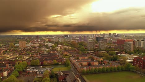 aerial drone skyline cityscape manchester city housing estate storm, england