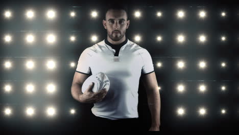 serious rugby player brings rugby ball