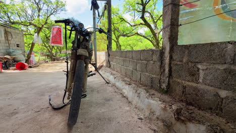 an old motorbike is parked in a rural backyard. evokes nostalgia, simplicity, and the charm of countryside life in vietnam.