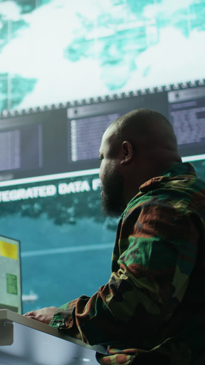Vertical Video Government intelligence officer in operation room managing surveillance activity
