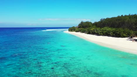 crystal-clear-turquoise-sea-water-and-tropical-island-with-wide-white-sand-beach