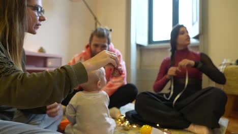 family celebrating christmas with baby