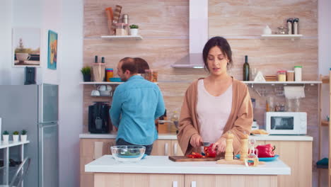 wife chopping bell pepper