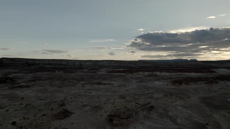 twilight over a barren desert landscape - aerial flyover