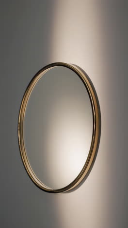 gold framed circular wall mirror