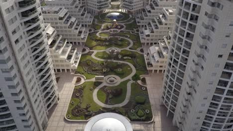 aerial view of modern residential complex with lush courtyard garden