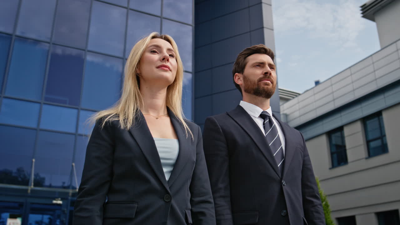 Confident business partners standing together in front office building closeup