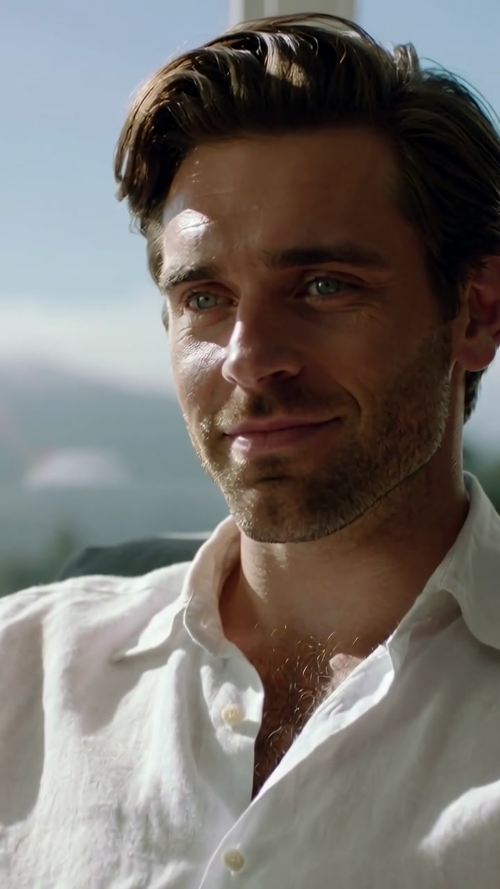 Vertical video: Offscreen cue causing man softening gaze and smiling while sunlight warming face