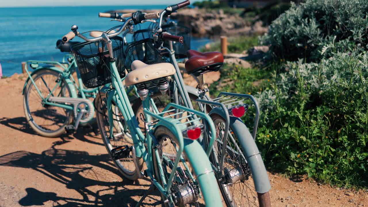 Close up of blue bicycles parked near the beach