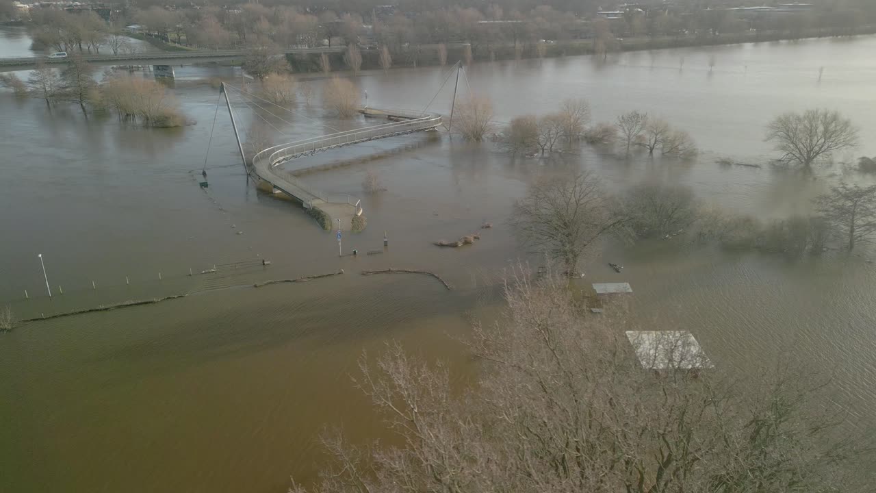 Pedestrian And Cyclist Bridge Over The Ems River Overflow After Storm In Meppen, Germany