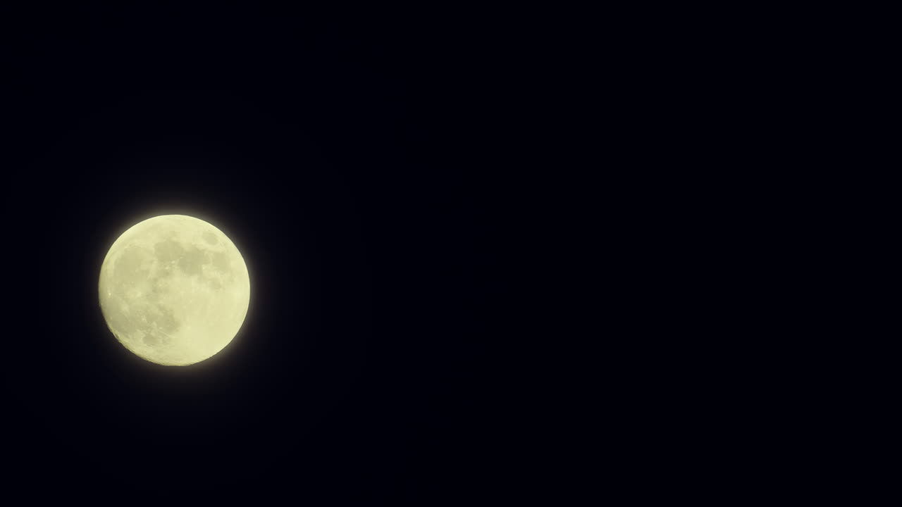 View of a full moon shining bright in the night sky
