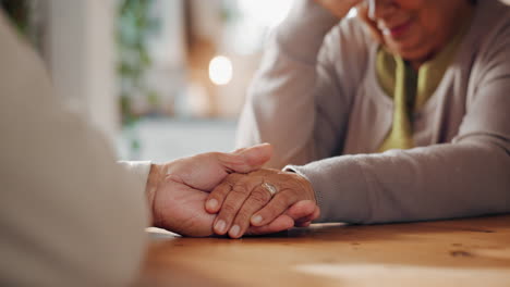 elderly couple holding hands and showing love and support