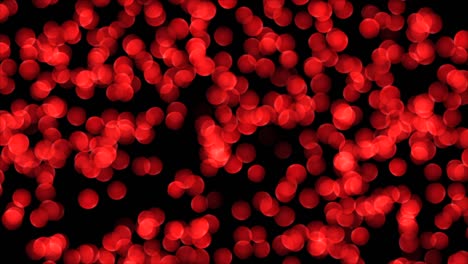 luces bokeh rojas sobre fondo negro