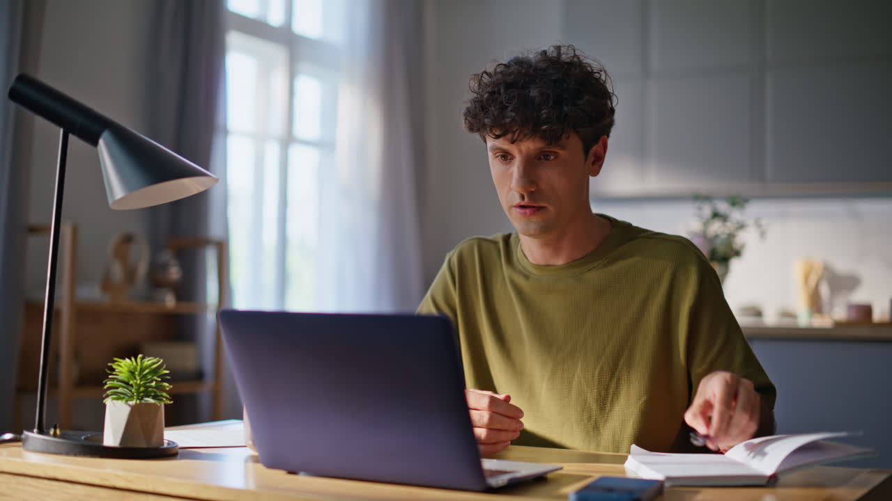 Startuper guy talking online meeting laptop closeup. Serious man video calling