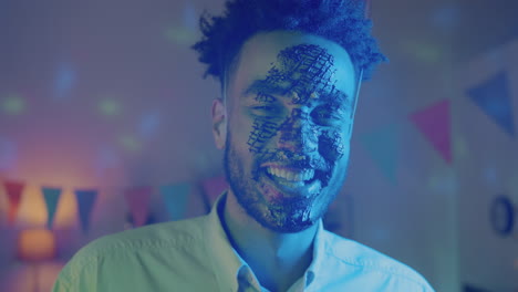 man with cake on face at a party