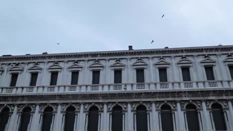 look up of the facades at st mark's square in venice, italy