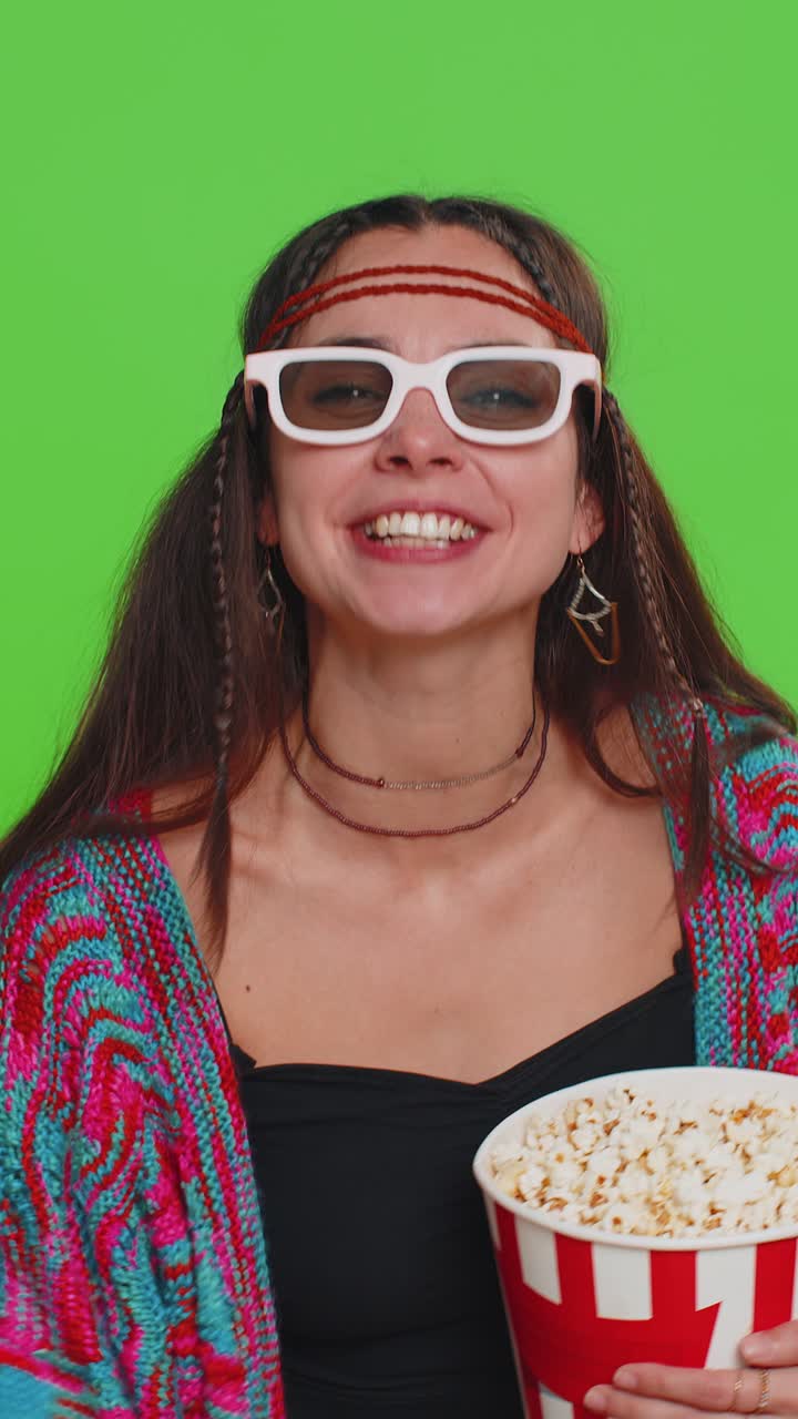 Woman in 3d glasses eating popcorn and watching interesting tv serial sport game film online movie