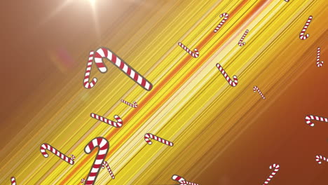 multiple candy cane icons falling against spot of light and trails light on yellow background