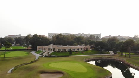 flying away from main building of golf field