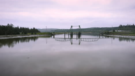 drone flying very low and slow over coquille river in bandon near oregon towards bullards bridge