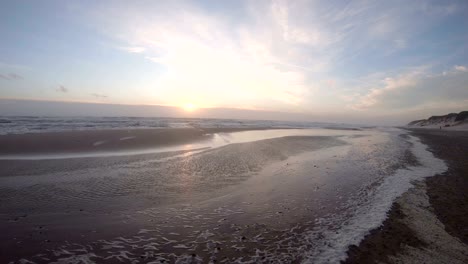 algae foam in storm on the beach in slow motion, sandy beach, north sea, jütland, sondervig, denmark, 4k