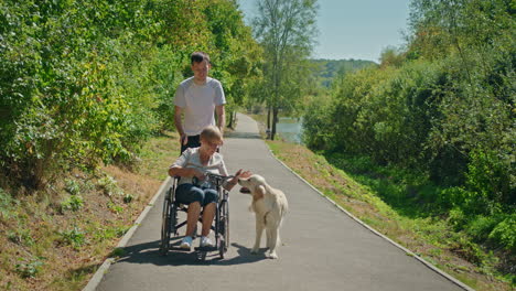 elderly woman in wheelchair with caregiver and dog
