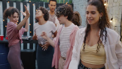 friends dancing at a backyard party