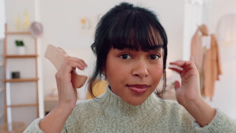 woman brushing her bangs