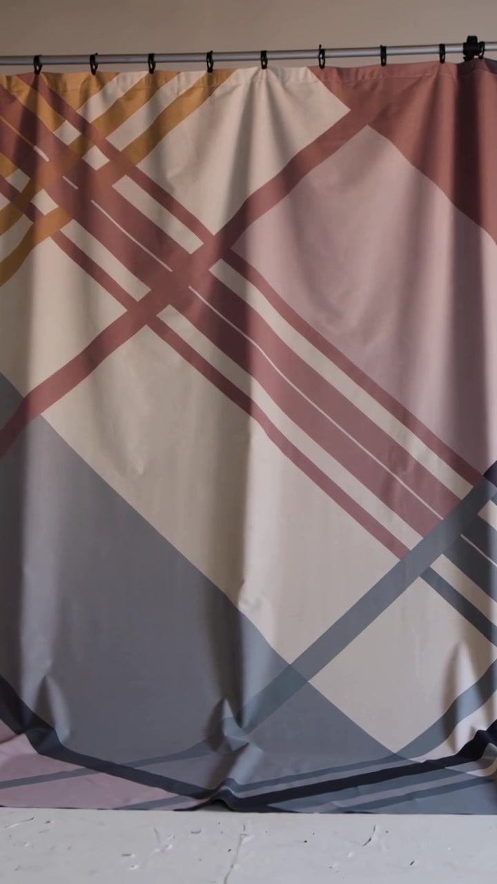 Vertical video: Moving striped curtain settling after right pan and light shift in room, rod clamp