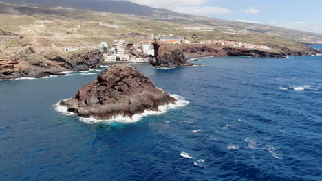 roques de fasnia, tenerife: aerial view in orbit of the rock formations of fasnia, where you can see the nearby beach and the intense blue sea