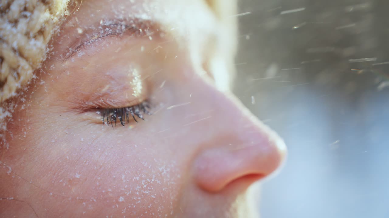 Woman's face covered in snow
