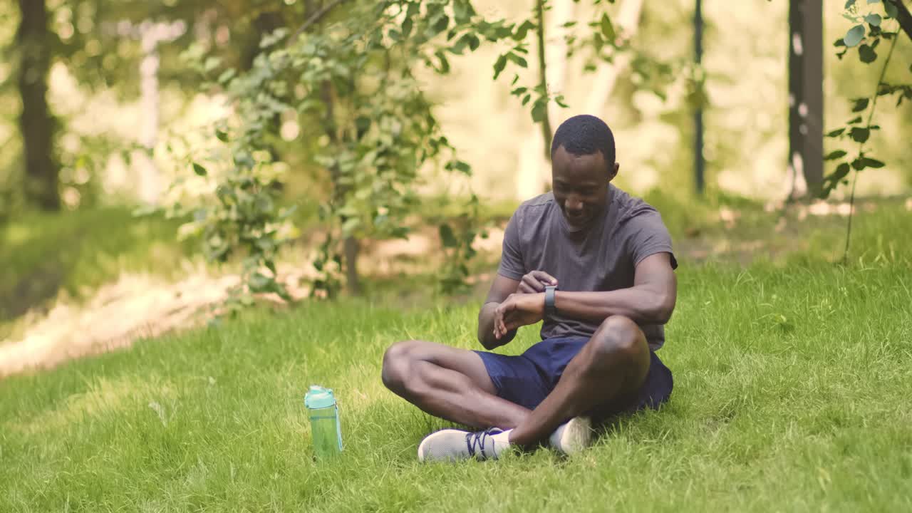 Man resting in park after workout