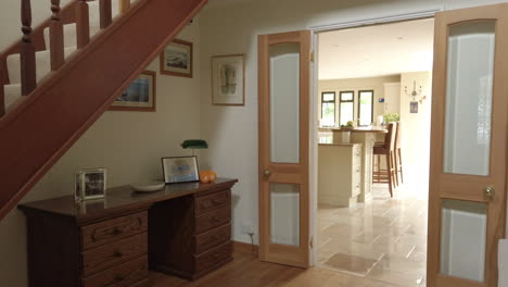 tilt shot of an entrance hall and staircase in a rural home in slow motion