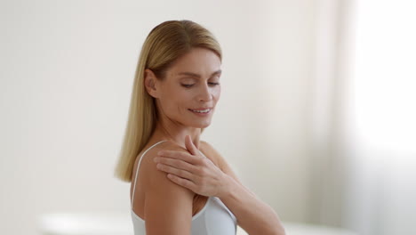 woman examining her skin