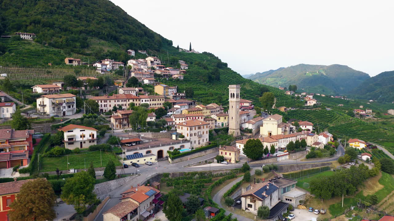 Vineyard-covered Hills And Charming Towns In The Valdobbiadene In The Veneto Region Of Italy. Aerial Sideways Shot