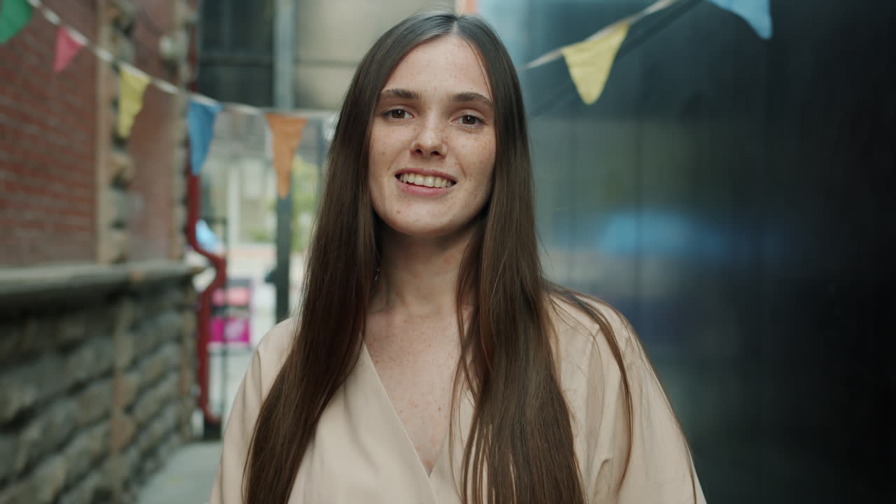 Woman Smiling in Urban Alleyway