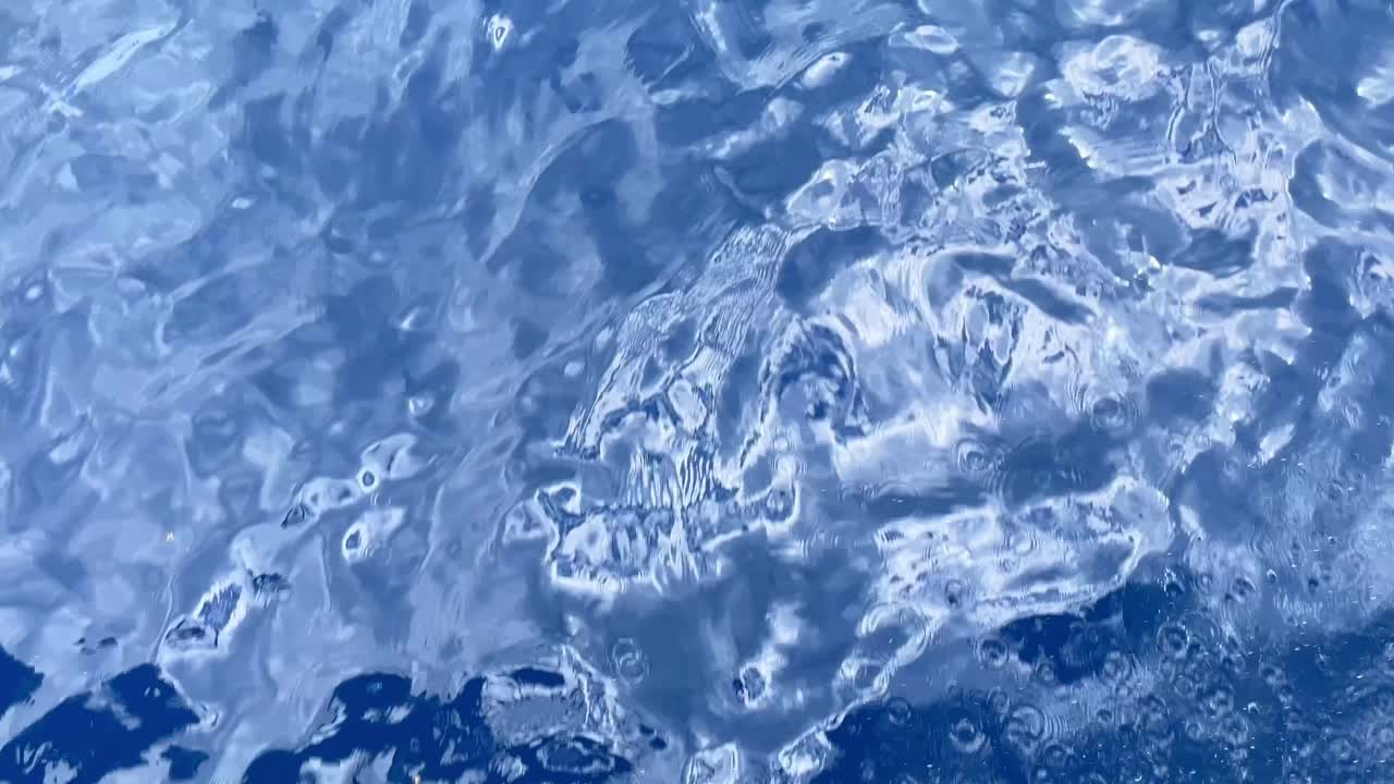 Ocean water passing under catamaran, Barbados 2025 UHD