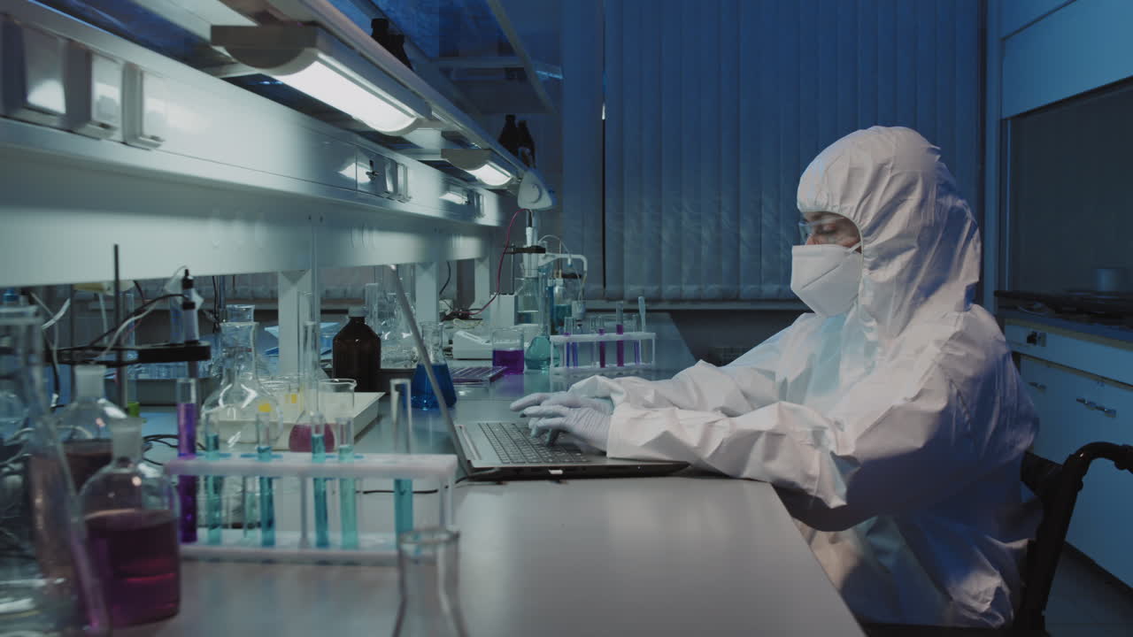Epidemiologist in Wheelchair Working in Lab