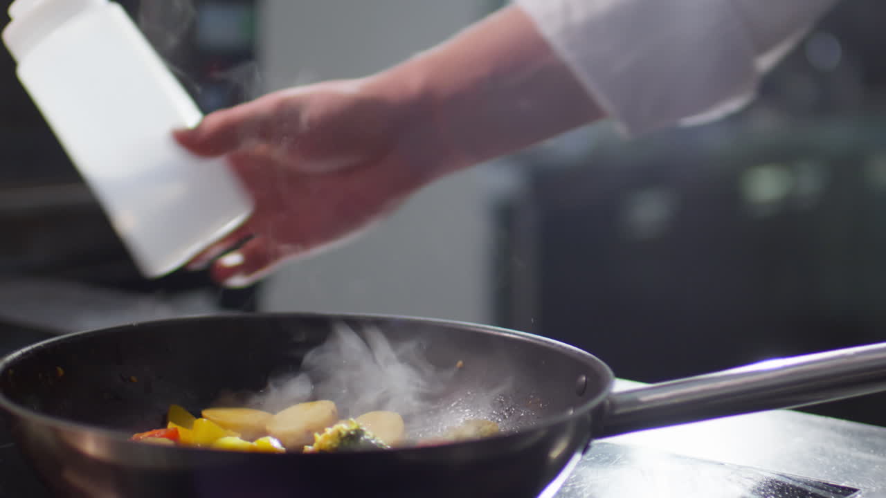 Chef Flambeing Food in Frying Pan