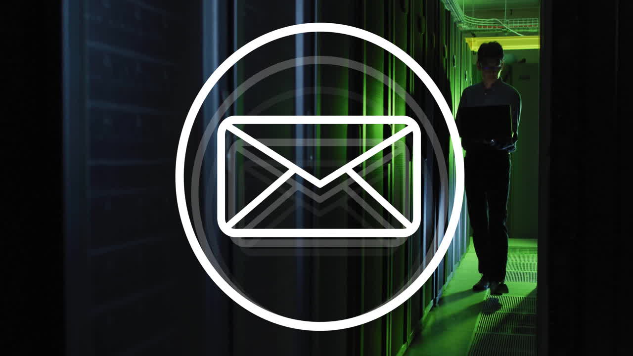 Animation of envelope email icon over male technician with laptop in dark computer server room