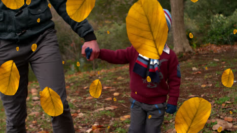 Animación-De-Hojas-De-Otoño-Cayendo-Sobre-Un-Feliz-Niño-Caucásico-Con-Su-Padre-En-El-Parque