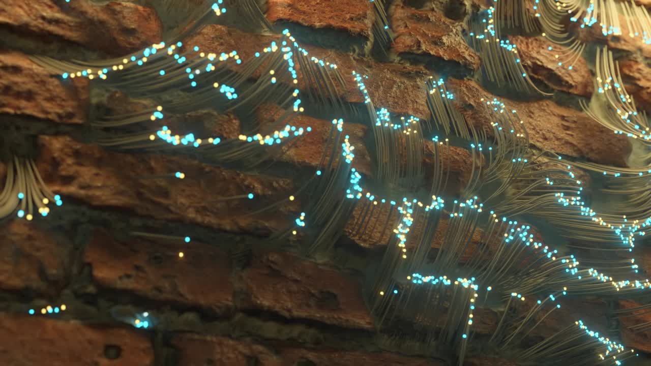 광섬유는 벽돌 사이에 나타나고 벽돌 벽을 따라 퍼집니다. 추상적인 기술 배경.