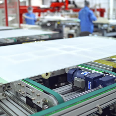 working factory mechanism of making solar panels. automated equipment for doing solar energy production. innovation technology concept.