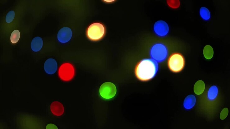 Animazione di macchie di luce colorate su sfondo nero