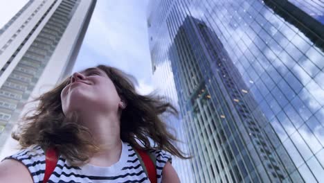 woman in front of skyscrapers